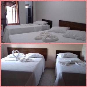 ItabaianaHotel Mirante do Vale的两张带白色床单和毛巾的床