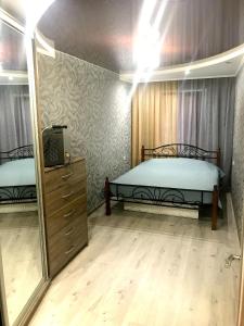 Apartment on Pushkina (Prospect Soborniy)客房内的一张或多张床位