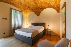 Relais San Vigilio al Castello客房内的一张或多张床位