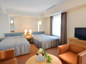 
神户皇冠饭店客房内的一张或多张床位
