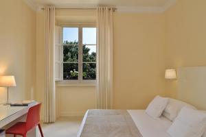 佛罗伦萨酒店客房内的一张或多张床位