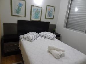 Apartamento Beira mar客房内的一张或多张床位