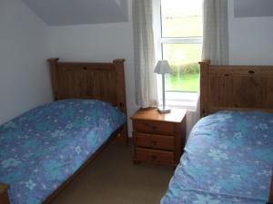 Aird Cottage客房内的一张或多张床位