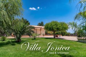加利波利B&B Villa Jonica的阅读别墅风之梦的标志住宿加早餐旅馆