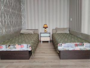 Apartment Pervomayskaya客房内的一张或多张床位