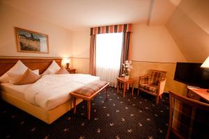 格伦瓦尔德城堡酒店客房内的一张或多张床位