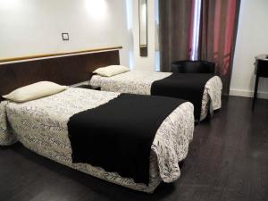 加梅里亚豪华酒店客房内的一张或多张床位