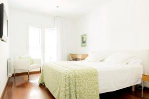 萨维纳斯埃尔皮拉尔公寓酒店客房内的一张或多张床位