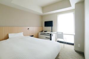 札幌站南口JR酒店客房内的一张或多张床位