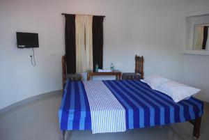 Hotel Jebasakthy客房内的一张或多张床位