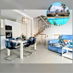 厄尔梅达诺Nuevo y acogedor duplex frente al mar的客厅配有桌子和蓝色沙发