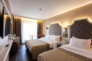 伊斯坦布尔女士Spa酒店客房内的一张或多张床位