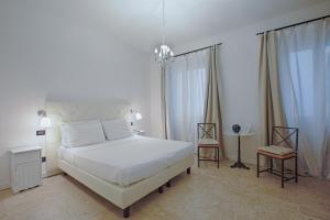 巴迪亚佛罗伦萨酒店客房内的一张或多张床位