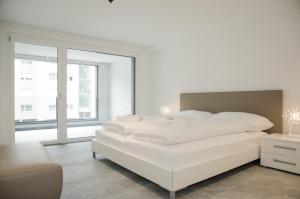 Apartment JungfrauCenter Brienzersee - GriwaRent AG客房内的一张或多张床位