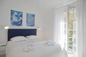 Maison d'Azur客房内的一张或多张床位