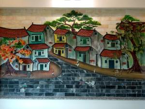 内排阿诺瓦机场酒店的墙上一幅房子的画