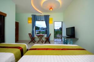 Hoi An Sea Sunset Homestay and Bar客房内的一张或多张床位