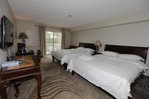 富丽通庄园酒店客房内的一张或多张床位