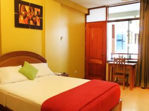 Hotel Centenario客房内的一张或多张床位