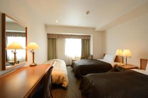 滨松协和酒店客房内的一张或多张床位