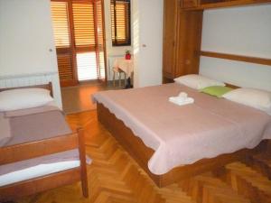 Apartments in Starigrad-Paklenica 33853客房内的一张或多张床位