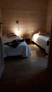 RukaNeliö Cottage客房内的一张或多张床位