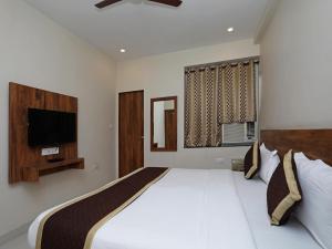 Hotel Triveni Residency客房内的一张或多张床位