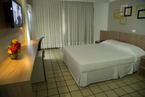 蒙萨皇宫酒店客房内的一张或多张床位