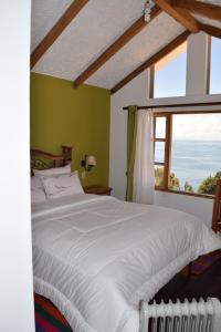 Wiñay Inti Lodge客房内的一张或多张床位