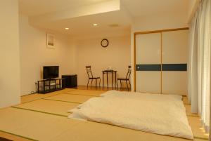Tsushima Dae-A Hotel客房内的一张或多张床位