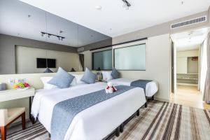 铜锣湾颐庭酒店客房内的一张或多张床位