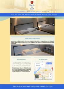 卢昂HOTEL DU JURA的网页上贴着卧室的照片