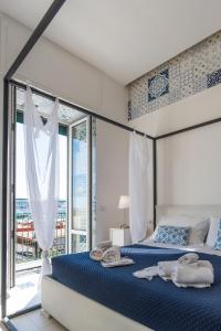 Relais Mareluna - Luxury Apartments客房内的一张或多张床位