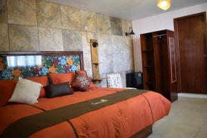 Hotel Las Candelas de Huamantla客房内的一张或多张床位