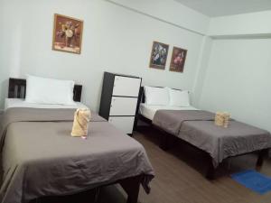 TT Hostel Chiangrai客房内的一张或多张床位