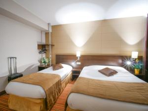 朗格勒朗格尔诺沃设计酒店的一间酒店客房,房间内设有两张床