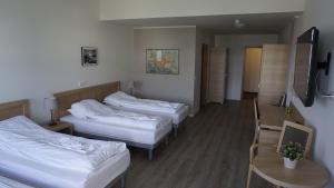 博加尔尼斯酒店客房内的一张或多张床位