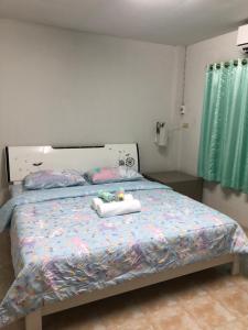 Pani House Hatyai 1客房内的一张或多张床位