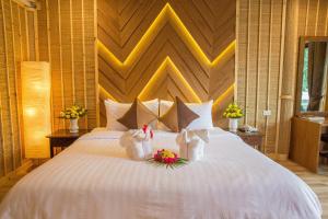 Adarin Beach Resort客房内的一张或多张床位