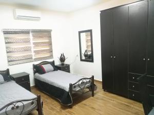 Aman Hostel客房内的一张或多张床位