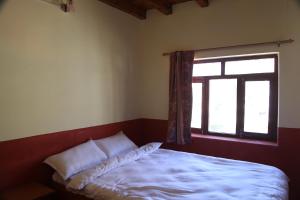 Himalayan Paradise客房内的一张或多张床位