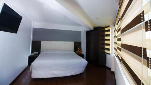 里贾纳公寓酒店客房内的一张或多张床位