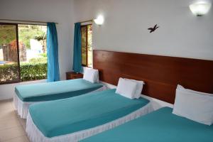 Piedras Blancas Lodge客房内的一张或多张床位