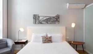 Trindade Premium Suites & Apartments客房内的一张或多张床位