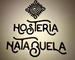 NatabuelaHotel y Hosteria Natabuela的一种读过尼洛雷亚纳加苏卢拉的标志