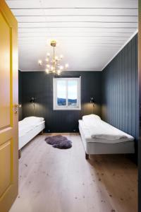 Buvik Sea Lodge Apartments客房内的一张或多张床位