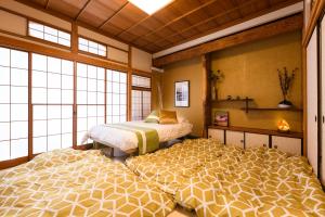 Suiren Residential Suite Tokyo客房内的一张或多张床位