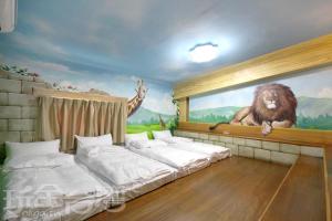 日月潭-旅台客居客房内的一张或多张床位