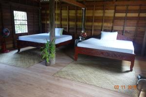Authentic Cambodian Angkor Cottage客房内的一张或多张床位