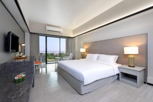 Tinidee Hotel Bangkok Golf Club - SHA Certified客房内的一张或多张床位